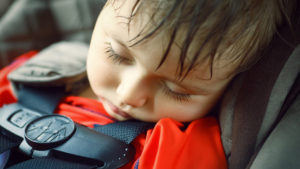 Closeup portrait of a cute adorable little boy toddler tired and sleeping belted in car seat on his trip, safety protection concept; Shutterstock ID 283664960; PO: today-david-150710